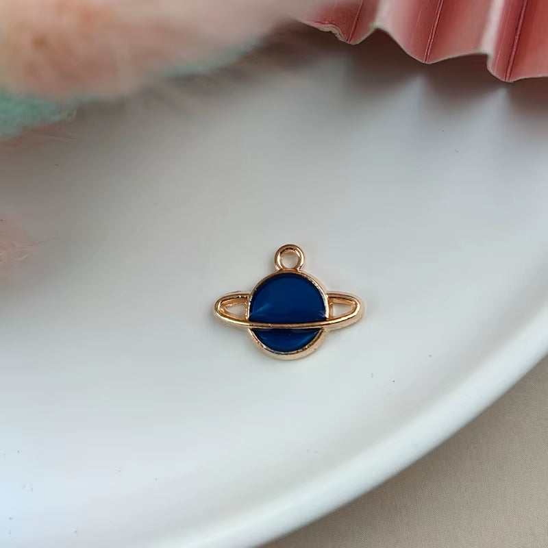 Dije Saturno Azul 22x27mm